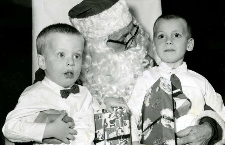 Guideposts: Two boys pose for a picture on Santa's lap